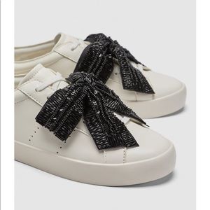 Zara white skater sneakers w/black sequins bow